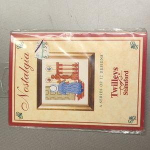 Hand Crafted counted cross kit with floss of woman with teddy bear.